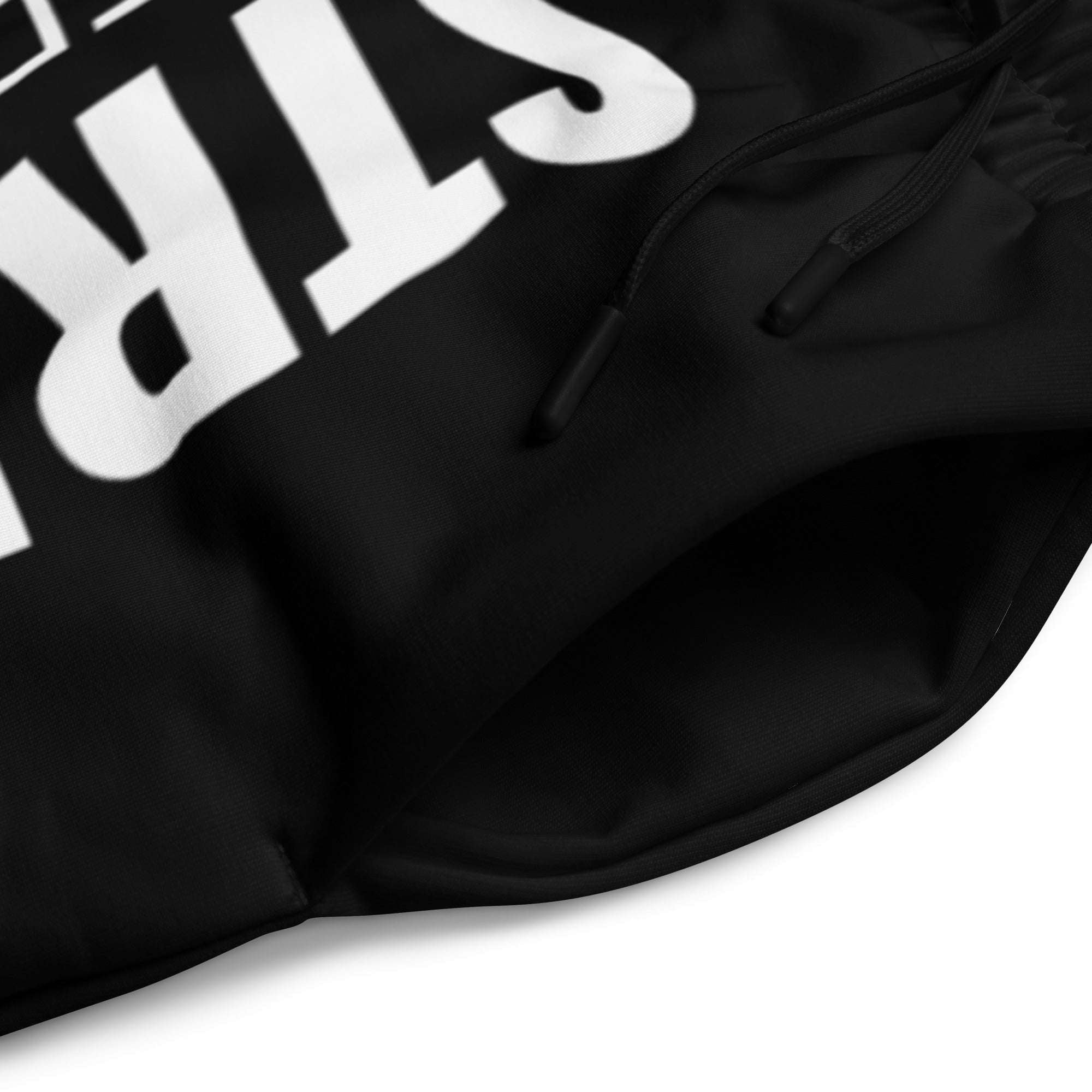 Close-up detail of men’s black wide-leg joggers fabric and waistband